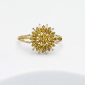 A 9ct yellow gold flower design ring set with 0.41 carats of yellow diamonds (not enhanced) and 0.10