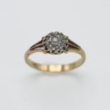 An 18ct yellow gold and diamond cluster ring, centre diamond round old cut diamond approx 0.70ct,