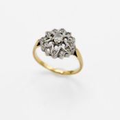 An 18ct yellow gold & platinum flower cluster ring set with small round cut diamonds, 3.34gm, size