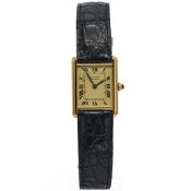 Cartier, a vermeil Tank Must De Cartier large wristwatch, quartz, on black Cartier leather strap,