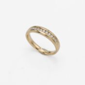 An 18ct yellow gold half eternity style ring set with a total weight of 0.25 carats of round