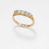 An 18ct yellow & white gold carved shank ring set with five graduated old round cut diamonds, 3.