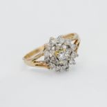 A 9ct yellow gold and diamond cluster ring, size M (hallmark rubbed).