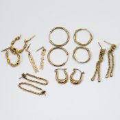 Seven pairs of 9ct yellow gold earrings of varying designs including hoops & chain designs, (some