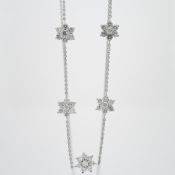 An 18ct white gold necklace with five diamond flower clusters, total diamond weight approx. 2.10