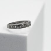 An 18ct white gold half eternity style ring set with round brilliant cut diamonds, total diamond