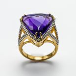 An impressive 18ct yellow gold diamond and amethyst ring, size N.