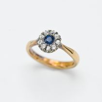 An 18ct diamond and sapphire cluster ring, size K.