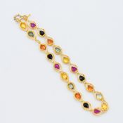 A delicate 18ct yellow gold bracelet set with pear shaped multi-coloured sapphires, total sapphire