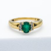 A gold diamond and emerald ring (unmarked but in our opinion possibly 18ct), size N.