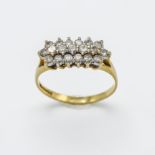 An 18ct yellow gold and diamond oblong ring, three rows of diamonds in claw setting, nineteen