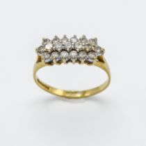 An 18ct yellow gold and diamond oblong ring, three rows of diamonds in claw setting, nineteen