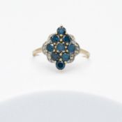 A 9ct yellow & white gold ring set with total weight 1.59 carats of blue diamonds (treated to