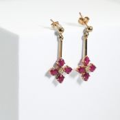 A pair of 9ct yellow gold earrings with a bar & flower drop, each set with four oval cut rubies,
