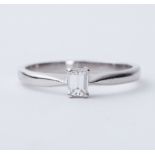 A platinum ring set with an emerald cut diamond, approx. 0.27 carats, approx.