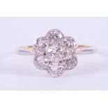 An antique 18ct yellow gold & platinum flower cluster ring set with approx. 1.27 carats