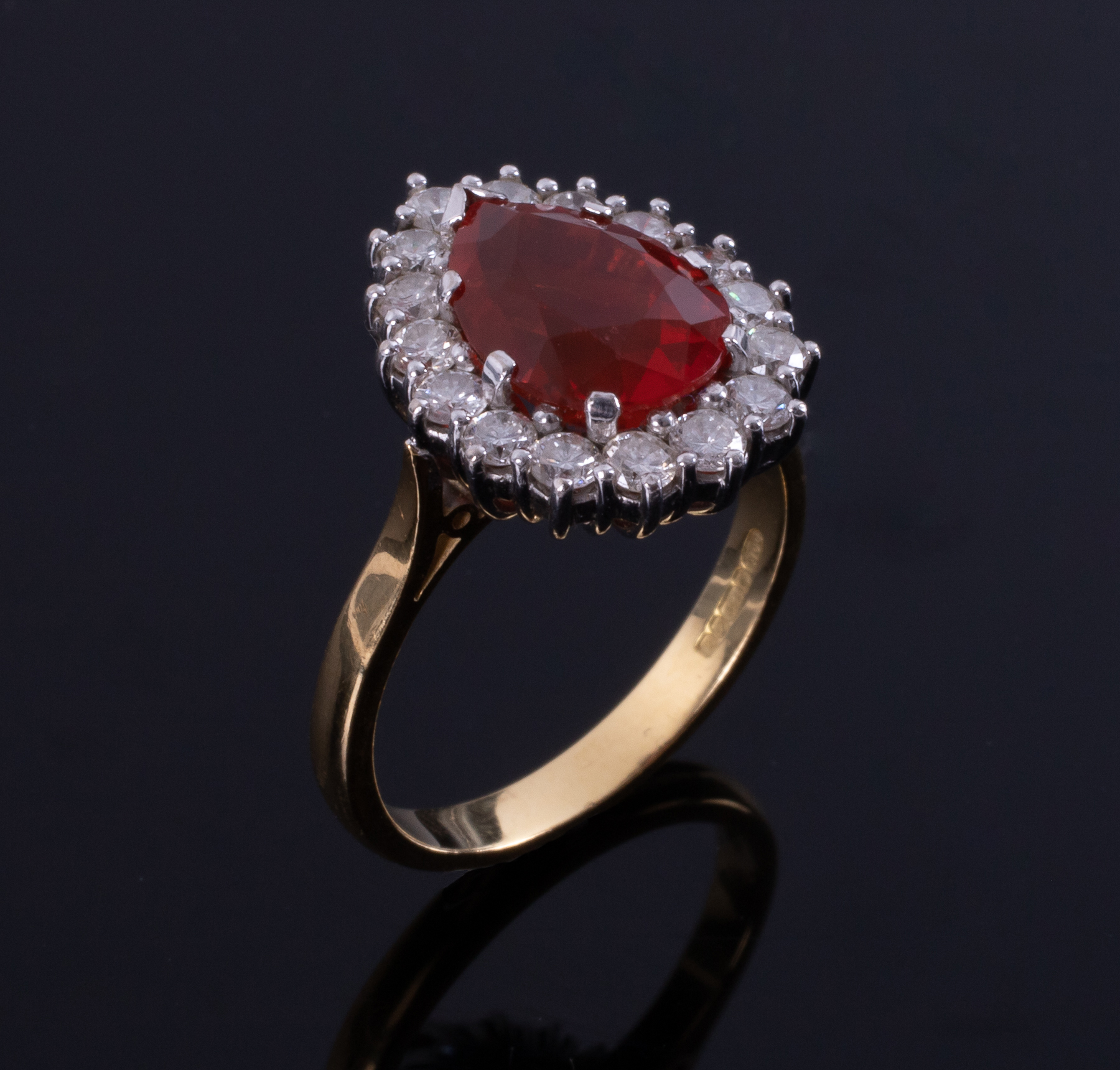 An 18ct yellow & white gold pear shaped cluster ring set with a central pear shaped fire opal - Image 2 of 2
