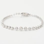 An 18ct white gold graduated line bracelet set with approx. 2.05 carats