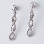 A pair of 9ct white gold twist design drop earrings set with round brilliant cut diamonds