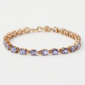 A 10k yellow gold bracelet set with oval cut tanzanite’s approx. total weight 7.20 carats