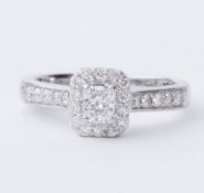 A platinum ring set with a central radiant cut diamond, approx. 0.35 carats