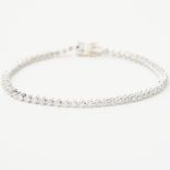 An 18ct white gold line bracelet set with approx. 1.92 carats of round brilliant cut diamonds