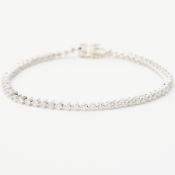 An 18ct white gold line bracelet set with approx. 1.92 carats of round brilliant cut diamonds