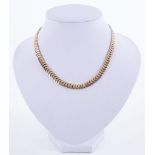 A 9ct yellow gold flat ‘herringbone’ style collar necklace
