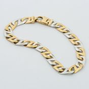 A 9ct yellow & white gold curb link design bracelet, length 21.5cm, with lobster catch