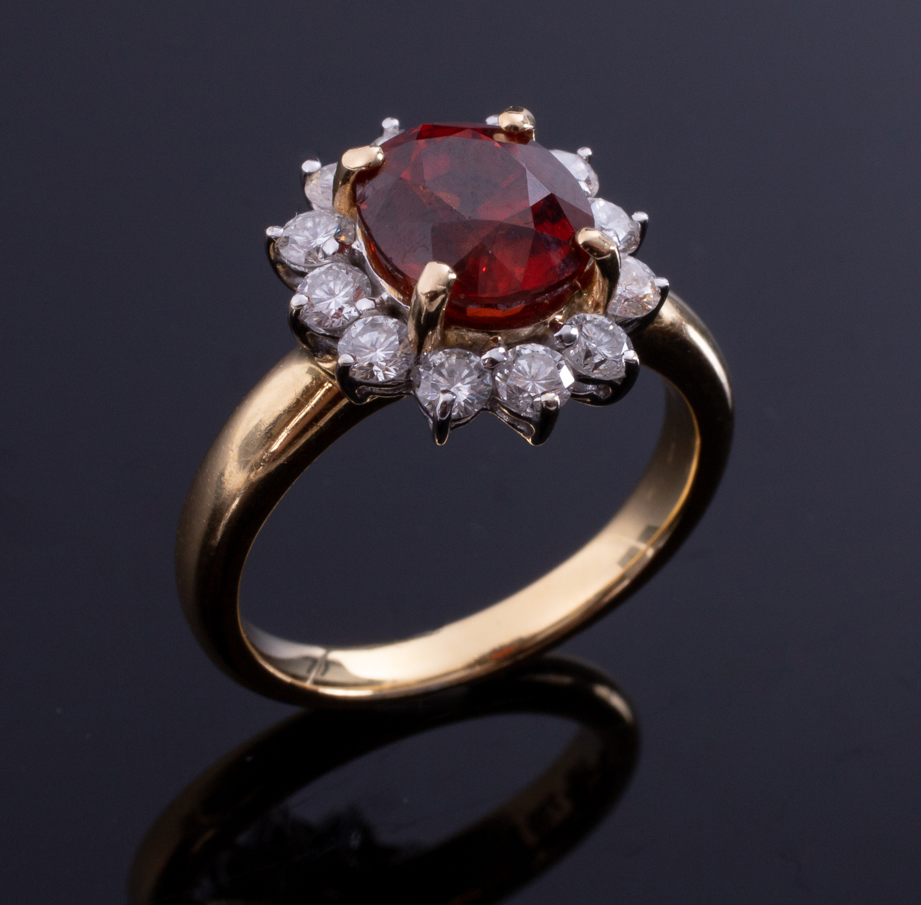 An 18ct yellow gold cluster ring set with a central oval cut orange garnet - Image 2 of 2