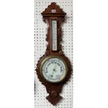 A carved oak two glass barometer with leaf pattern, 86cm x 32cm.