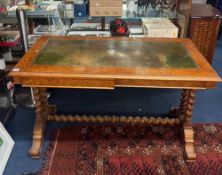 A Victorian Burr walnut and walnut writing table with twist stretcher base, 123cm x 61cm.