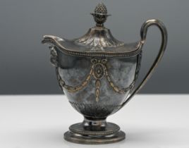 A George III ornate silver cream jug with shaped lid (loose) decorated with ribbon and Follette