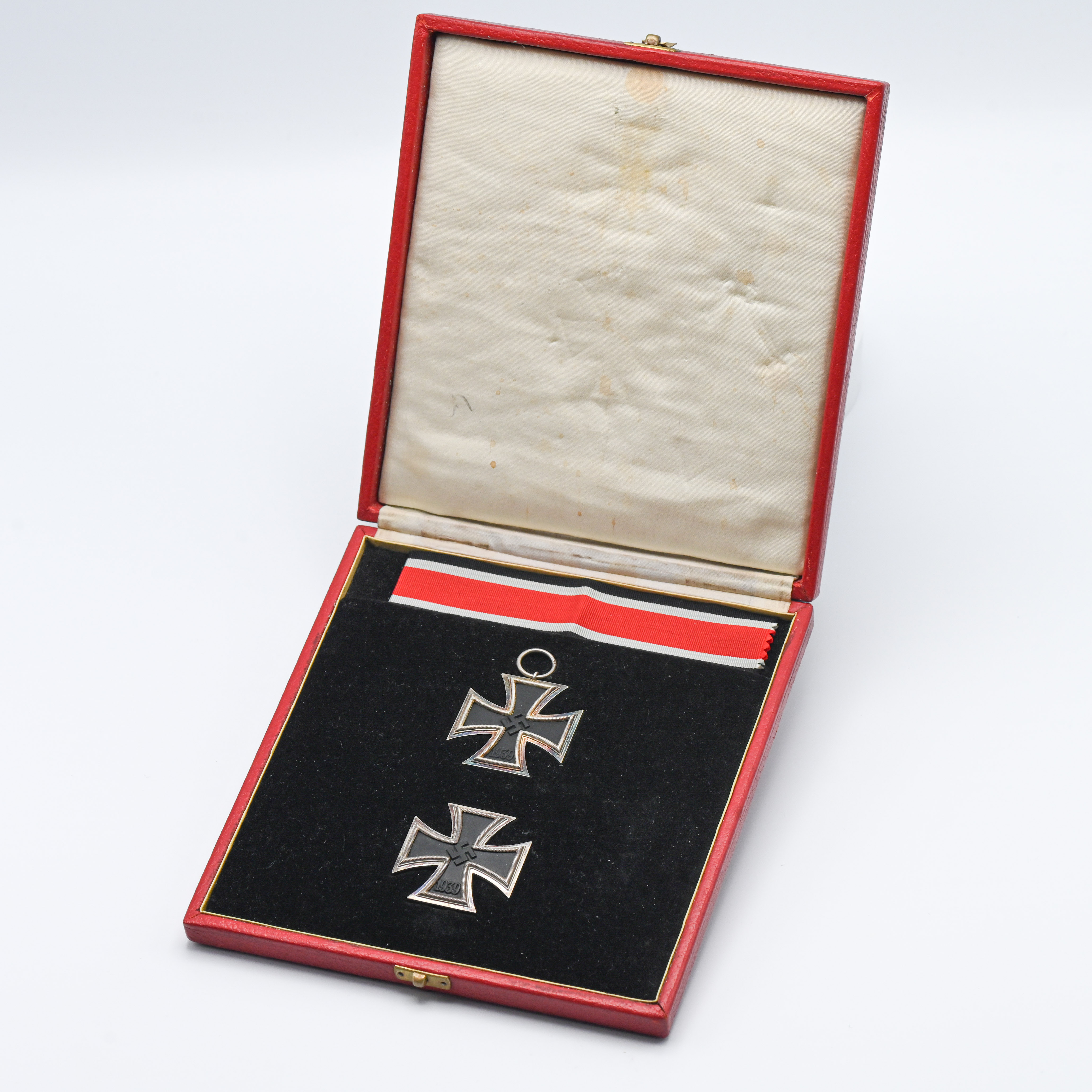 German Military 1st and 2nd Crosses in Red presentation case, with embossed national Eagle.