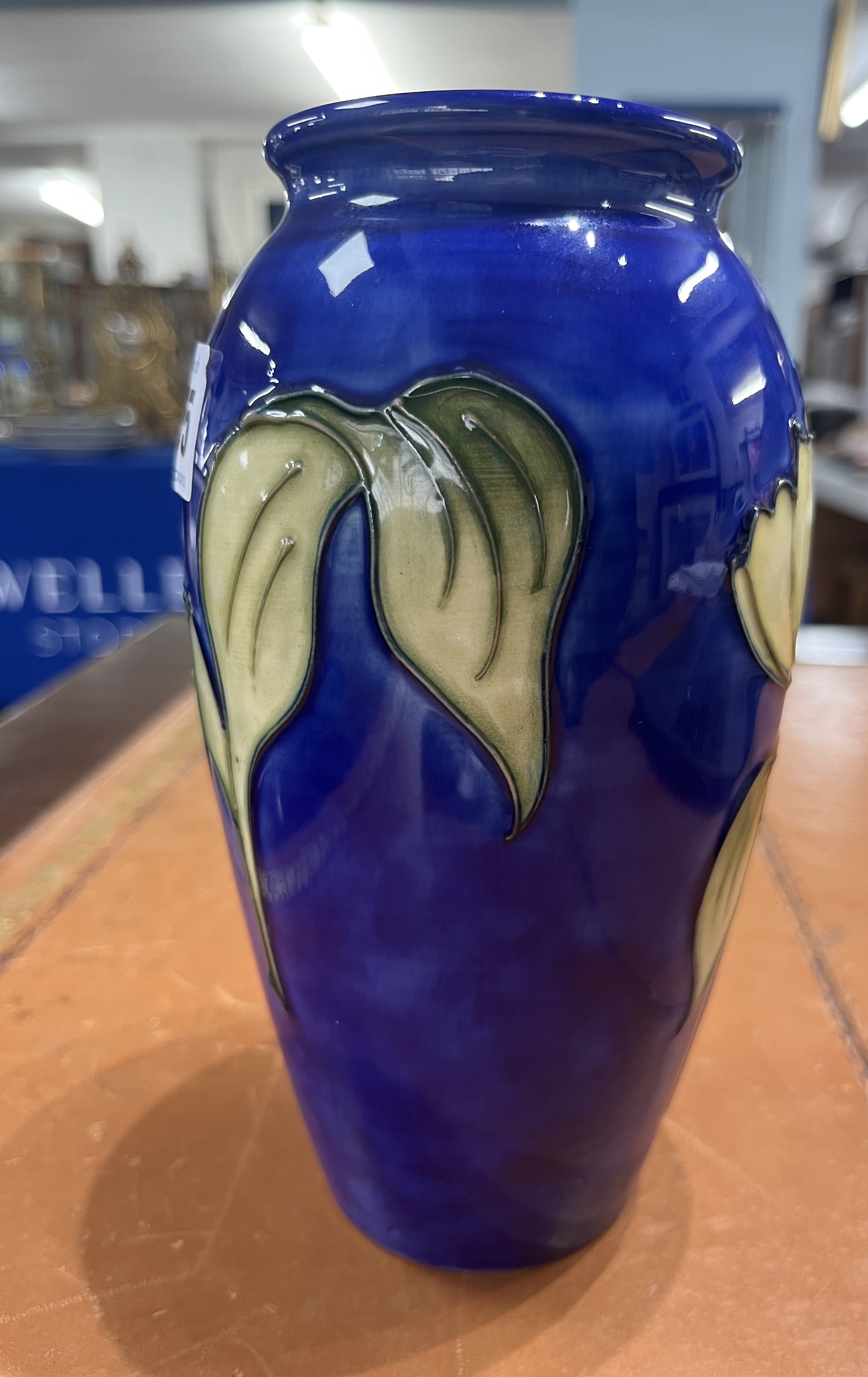 A Moorcroft vase decorated with yellow Tulips on blue background, limited edition of 50, 19cm - Image 2 of 5