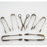 A selection of silver tongs & a pair of silver grape scissors, Exeter, total weight 10.60oz.