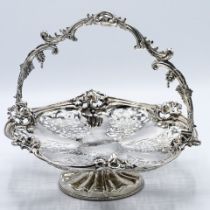 A Victorian silver pierced and decorated fruit basket with swing handle, Exeter, circa 1852, RJ &