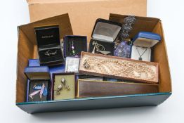 A box of various costume jewellery including silver necklace, earrings, brooches etc.
