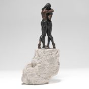 A 20th century sculpture embracing couple, with plaque Joseph Bofill on a rocky base, height 33cm.