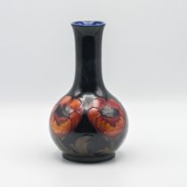 A William Moorcroft big Poppy design onion vase, circa 1923, 23cm height.