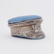 A rare novelty early 20th century silver pin cushion in the form of a Naval officers cap, the blue