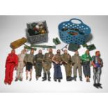 A set of fifteen action figures, circa 1970, varying in size, including Action Man, Batman, and