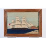 19th Century sailors woolwork depicting a 'Masted sailing ship on the coast with figure on the