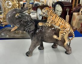 A large Beswick Elephant with Lion on the back.