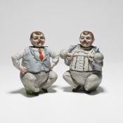 A pair of German colourfully glazed bisque porcelain figures with nodding heads, one depicted