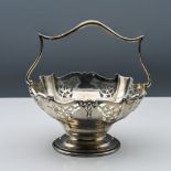 George V silver sweet basket, with fixed curved handle, open scroll and ribbon pattern, makers