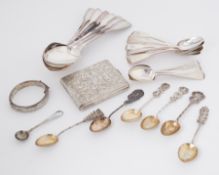 A mixed lot of silver to include a quantity of different spoons, a Continental silver ornately