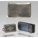 Three white metal snuff / small boxes (two are possibly silver) comprising one with indistinct