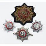 Three metal Plymouth Fire Brigade badges including Plymouth City Airport Fire Service and one