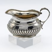 George V silver cream jug with half fluted body, Birmingham, approx. 6.63oz.